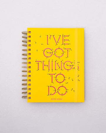 yellow medium 17-month planner with pink connect the dots and yellow elastic closure